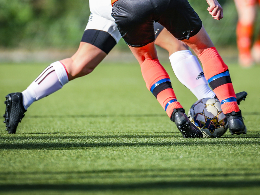 Athlete performing a change of direction movement, highlighting the mechanism commonly associated with lateral ankle sprains.